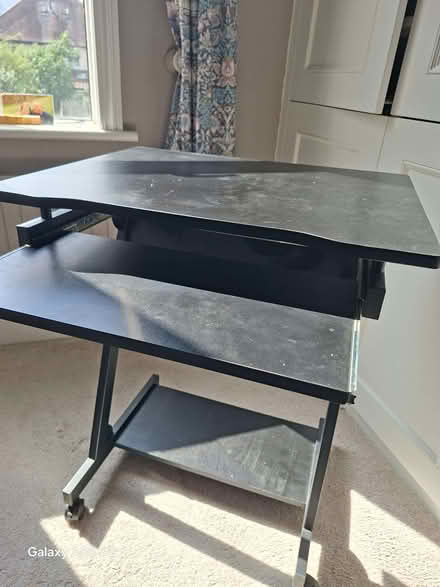 Photo of free Computer desk, black, on wheels (Raynes Park SW20) #1
