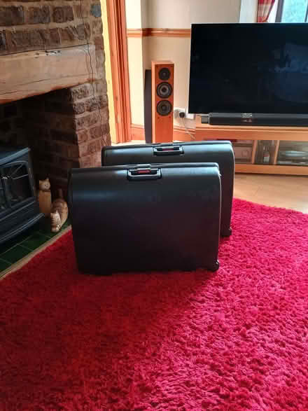 Photo of free Two large black suitcases with rear wheels and combination l (Moor Park L23) #1