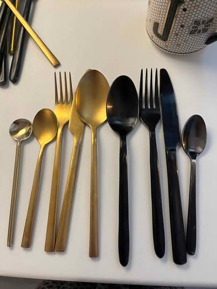 Photo of free 2 sets of cutlery, one black the other one gold. (Barons Court W14) #1