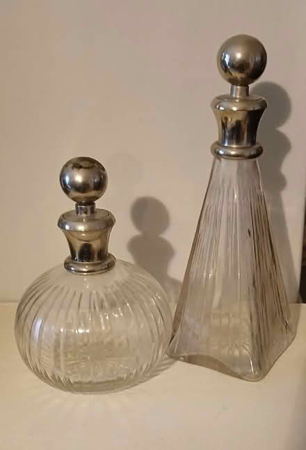 Photo of free Two decorative glass bottles heavy silver coloured stoppers (South Croydon CR2) #1