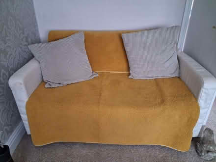 Photo of free White 2 seater sofa bed. Dimensions 55 inch W 32 inch 31 D (The Windmill WS15) #2