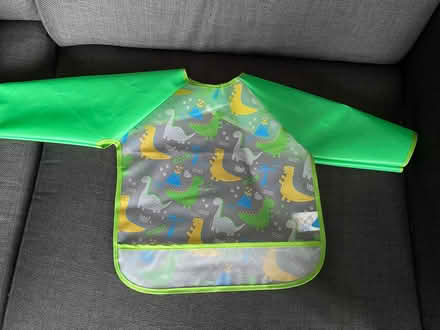 Photo of free Dinosaur cover up bib (Thringstone LE67) #1