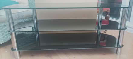 Photo of free Large Dark glass TV unit (Bury St Edmunds, IP33) #1
