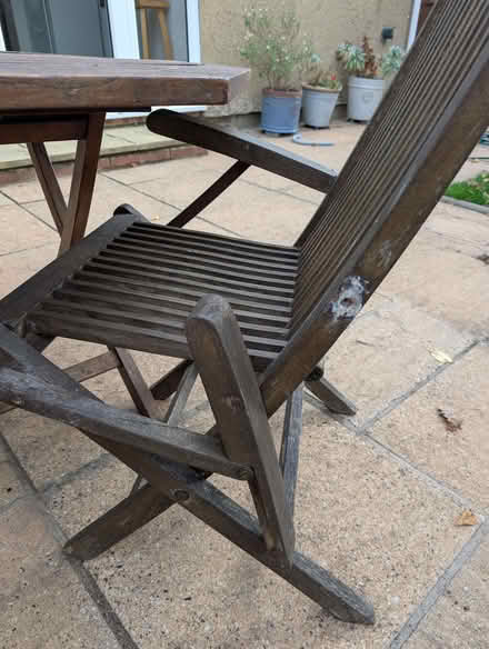 Photo of free Solid teak outdoor table and chair (note needs repair) (Kidlington OX5) #1
