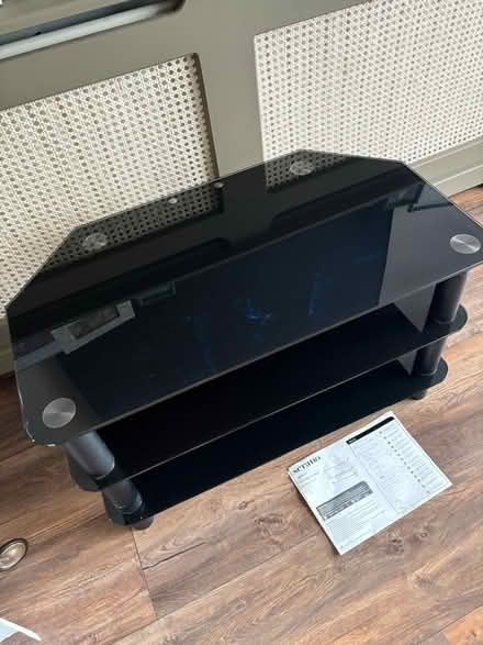 Photo of free Black glass tv stand (Woodham) #2