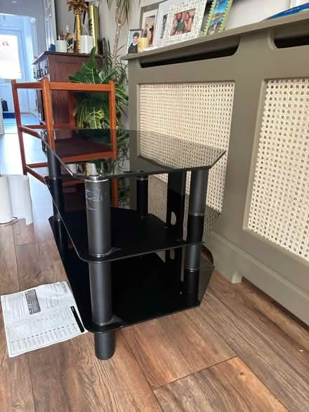 Photo of free Black glass tv stand (Woodham) #3