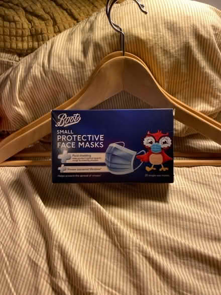 Photo of free 20 Small Face Masks Unopened + Wooden Coat Hangers (CT11) #1