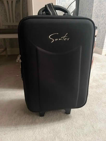 Photo of free 20” black suitcase (Keighley) #1