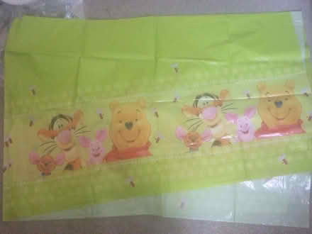 Photo of free Winnie the Pooh plastic tablecloth & pack of serviettes (Kinson Village Green Stocks BH10) #2