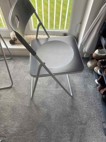 Photo of free 2 Ikea black plastic fold up chairs (Spalding PE11) #1