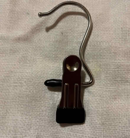 Photo of A hook that has a clasp/grip at the bottom. (CT2) #1