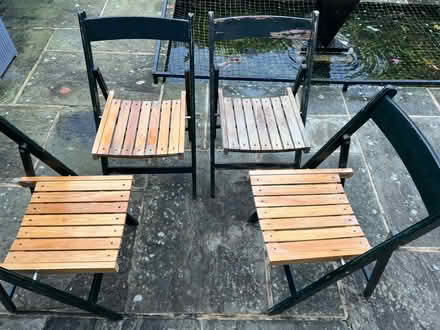 Photo of free Four wooden folding chairs (Knotty Green HP9) #1