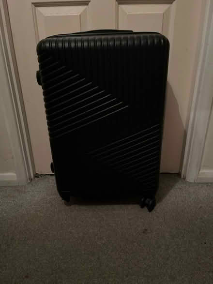 Photo of free Black luggage (OL8 2XQ) #2