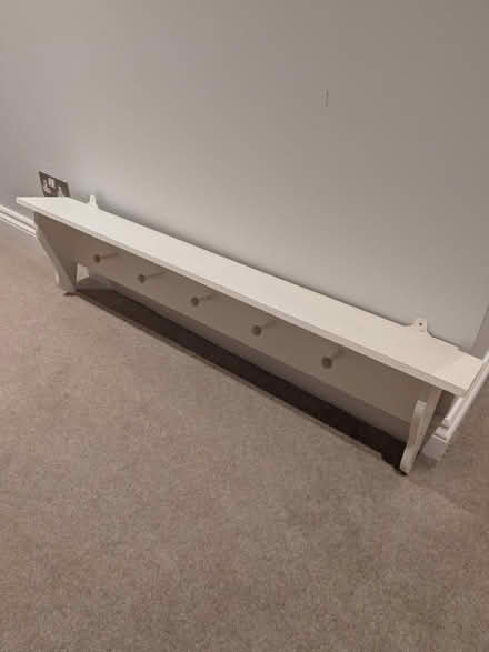 Photo of free White wood shelf with hooks (Weybridge) #1