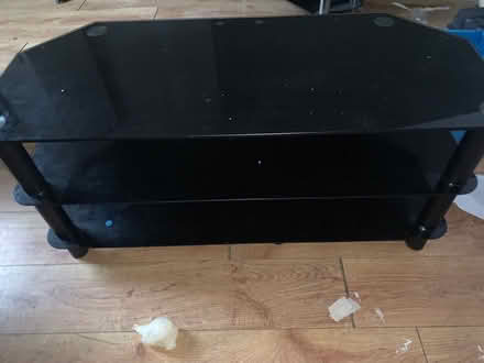 Photo of free Black glass tv stand (Radcliffe) #1