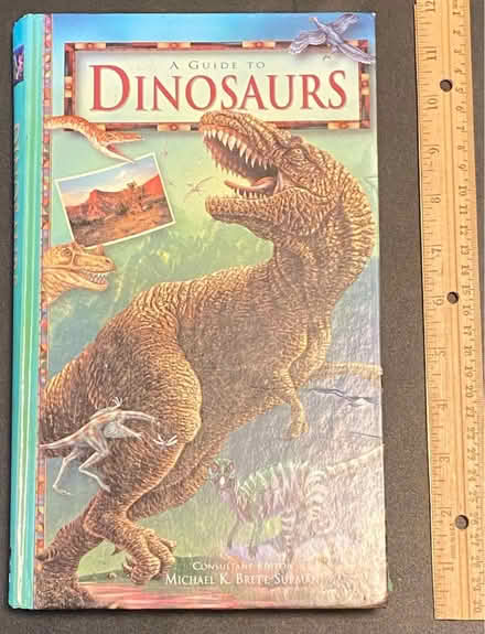 Photo of free Dinosaur book (Nr Fresh Pond & Mt Auburn Cem.) #1