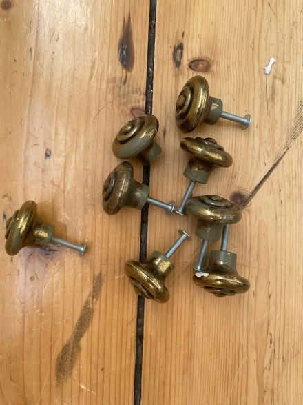Photo of free 8 cupboard door knobs- ages brass effect (Harrogate HG2) #1