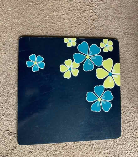 Photo of free 29cm sq. Set of 8 Black Cork Backed Placemats with Flowers (St James, South Elmham IP19) #1