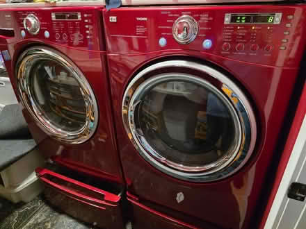 Photo of free LG red washer dryer with pedestals (Adelphi near mill 20783) #1