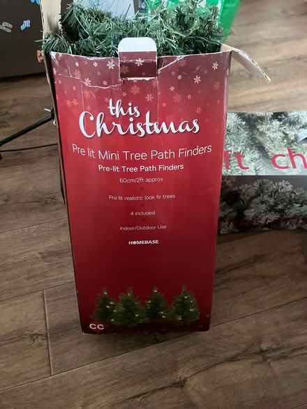 Photo of free 4x mini (no lights) Christmas trees on lawn stakes. (Little Tey CO6) #1