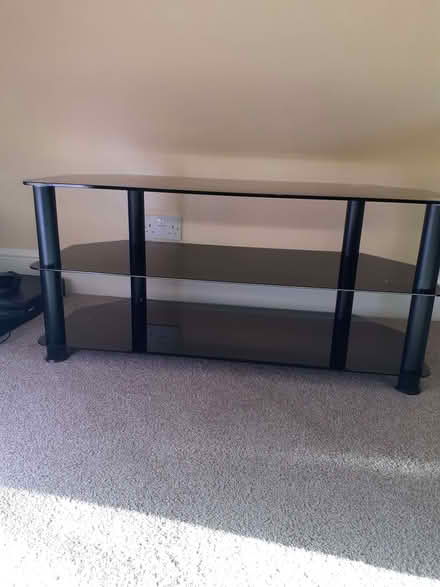 Photo of free Black glass TV stand (Pakefield NR33) #1