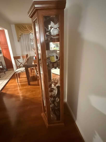 Photo of free Corner curio cabinet (Lanham area- good luck road) #2