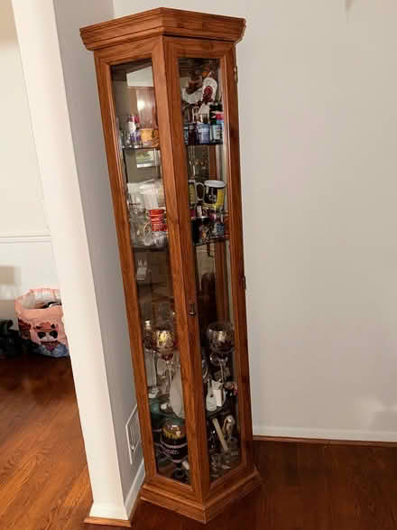 Photo of free Corner curio cabinet (Lanham area- good luck road) #1