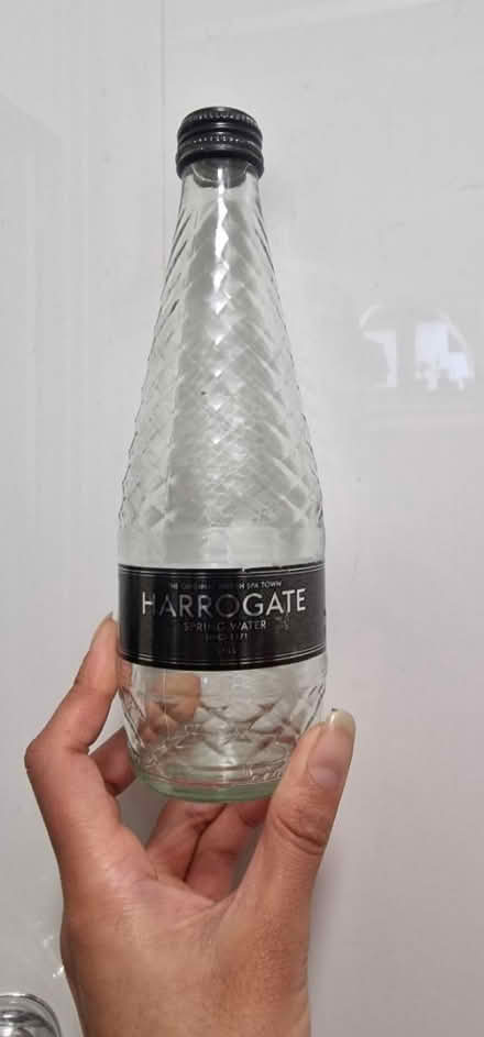 Photo of free Empty 330ml glass water bottles (Canning Town E16) #1