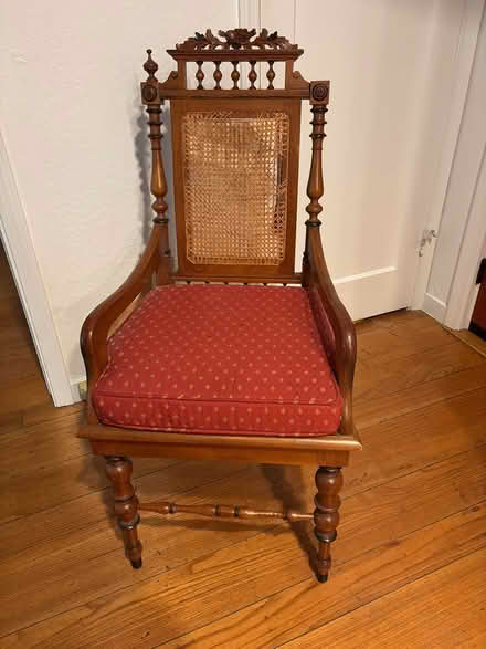 Photo of free carved wood chair with red cushion (Orinda. 27 Glorietta Ct) #1