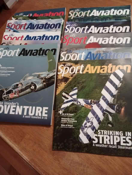 Photo of free magazines, broth, used votives (55th & Main) #1