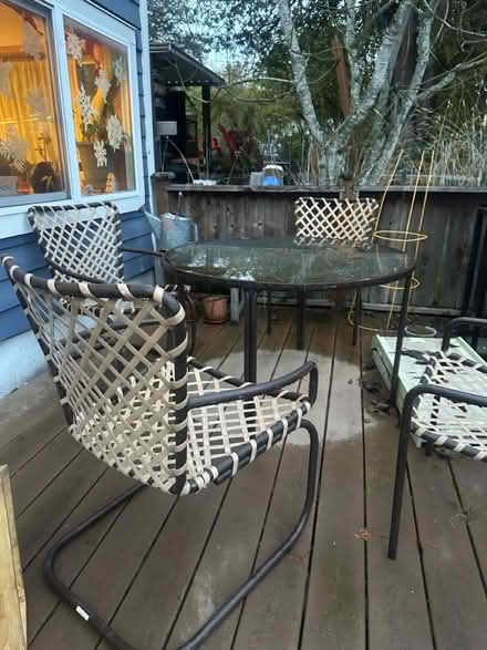 Photo of free Glass top patio table 4 chairs (NE Seattle) #1