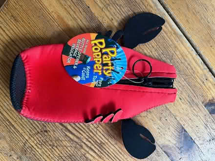 Photo of free Beer bottle sleeve and opener (Ottawa west) #1