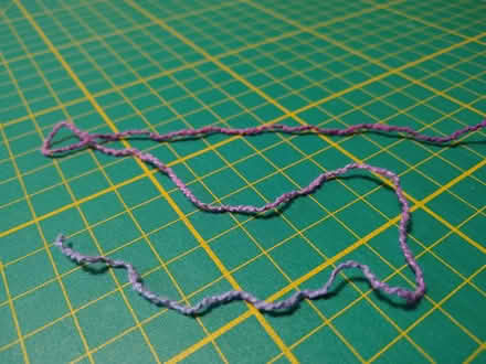 Photo of free Thin hand-dyed boucleĢ yarn, partially knitted (West Croydon CR0) #2