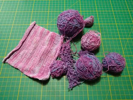 Photo of free Thin hand-dyed boucleĢ yarn, partially knitted (West Croydon CR0) #1