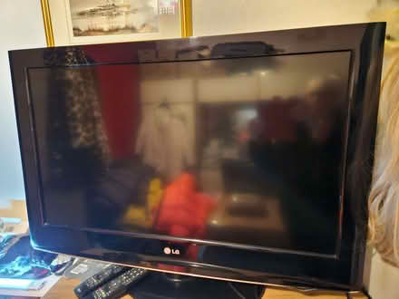 Photo of free 32" LG TV (not smart)on a stand with 2 remotes. (Enfield EN1) #1