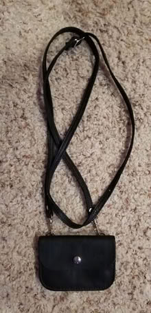 Photo of free Very small black leather purse #1