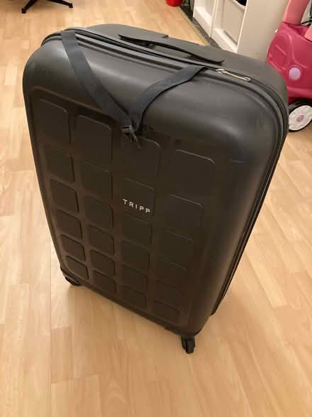 Photo of free Tripp suitcase 1 worn wheel (Southfields SW18) #1