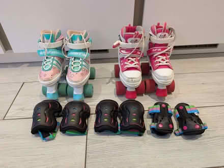 Photo of free Two pairs of adjustable junior roller skates with pads (Crowthorne RG45) #1