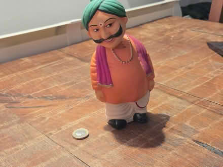 Photo of free Indian man pottery bobblehead (GL53 Charlton Kings) #1
