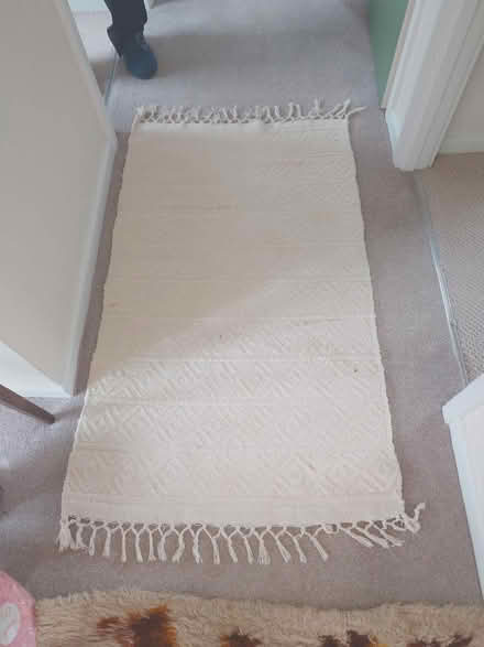 Photo of free Cream rug good condition 70cm x 138cm (Putnoe MK41) #1