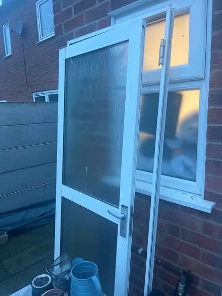Photo of free Outside door. Glass and metal along with Frame (Chigwell IG6) #1