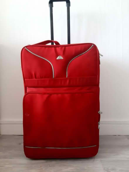 Photo of free Red Suitcase with wheels (Tolworth KT6) #1