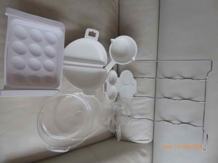 Photo of free Items microwave use, undershelf eggtray & metal bottle rack. (Marazion TR17) #1