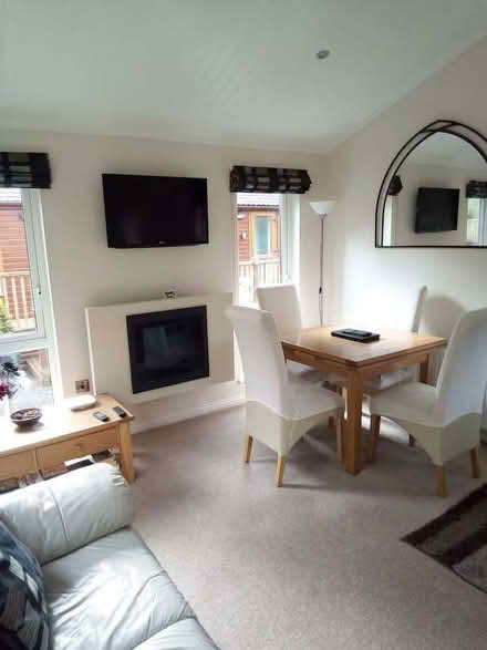 Photo of free 2 cream leather two-seater sofas and four dining table chair (Blencarn CA10) #1