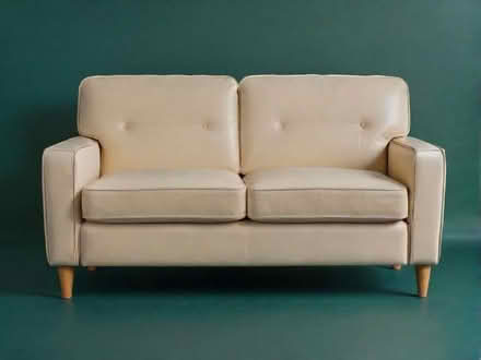 Photo of free 2 seater beige faux leather sofa (Moor Allerton LS17) #1