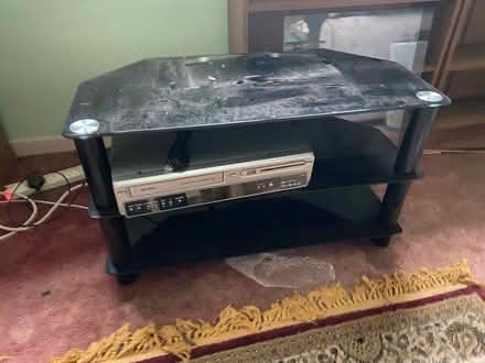 Photo of free Black glass TV stand (M15 Hulme) #1