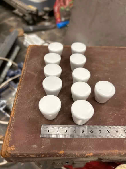 Photo of free 11 white cabinet knobs (Haldens AL6) #1