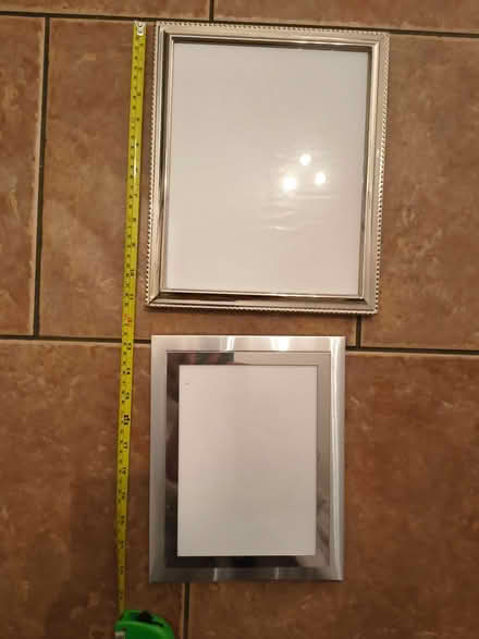Photo of free 2 silver coloured photo frames (Hook KT9) #1