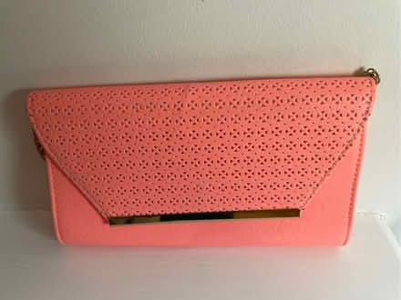 Photo of free Coral Pink Clutch Bag with Gold Chain & Perforated Detail (West Brompton SW6) #1