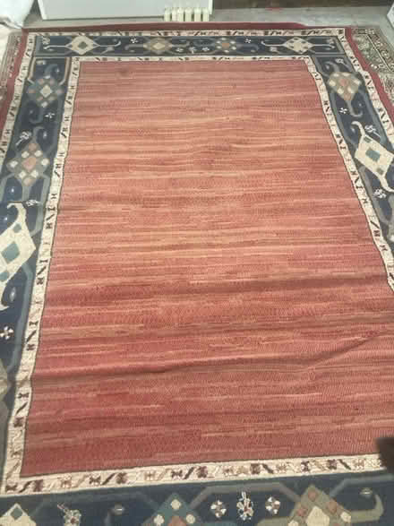 Photo of free Large reddish rug with grey boarder (Seven sisters near overground) #1